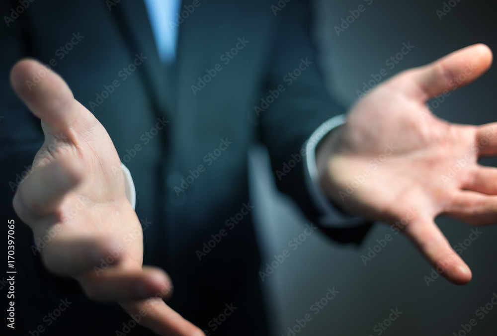 Businessman showing his empty hand