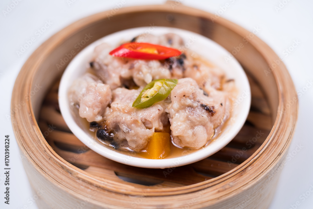 Meat balls with tomato sauce and wooden spoon, close-up Meat balls with tomato sauce and wooden spoon, close-up