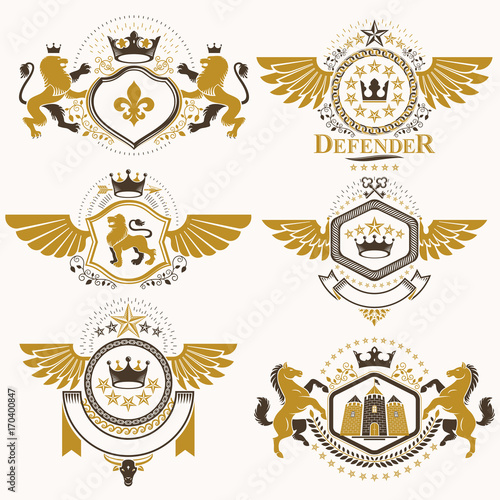 Heraldic vector signs decorated with vintage elements  monarch crowns  religious crosses  armory and animals. Set of classy symbolic graphic insignias with bird wings.