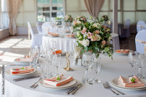 Wedding decor. Flowers in the restaurant, table setting