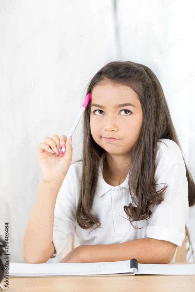 Portrait of asian cute girl thinking about with colour pen . Portrait of asian cute girl thinking about with colour pen .