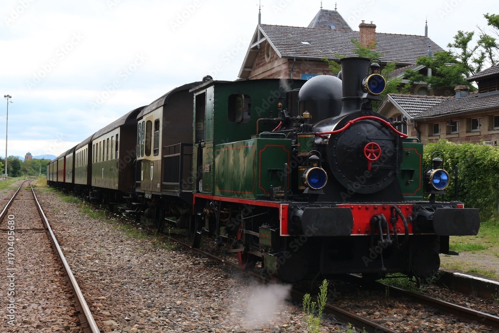 Restored historic steam engine train at station