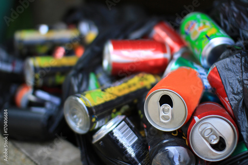 Colorful aluminum cans all together for recycling metal waste to help polution on Earth and to be environmentally friendly photo