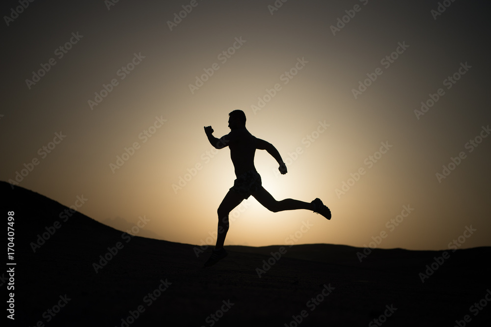 silhouette or man runner, guy running outdoor at clear sky