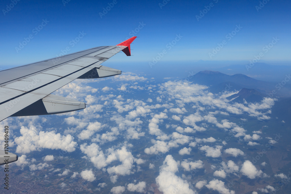 Fototapeta premium The view from the airplane window flying in the sky.