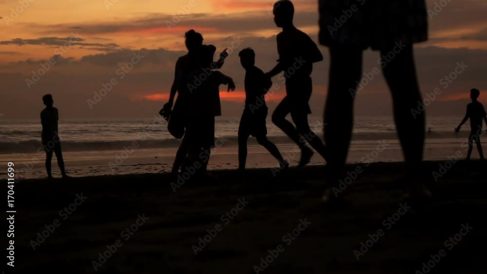 Group of teenagers playing football on beach during sunset, super slow motion 240fps
Group of teenagers playing football on beach during sunset, super slow motion 240fps