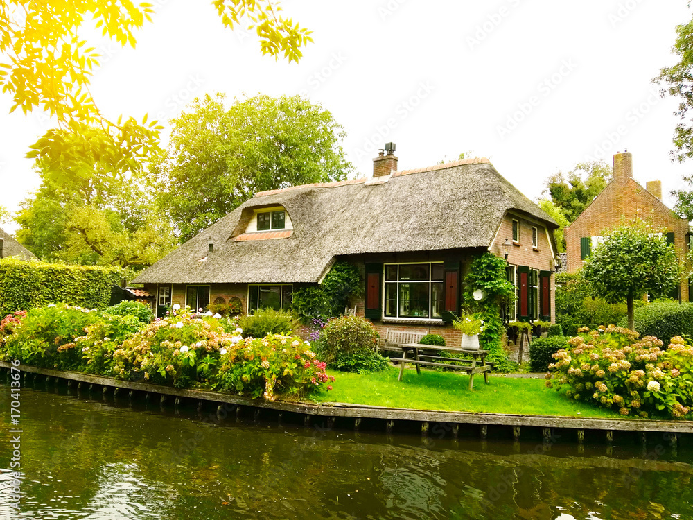 GIETHOORN, NETHERLANDS - dutch countryside of houses and canal