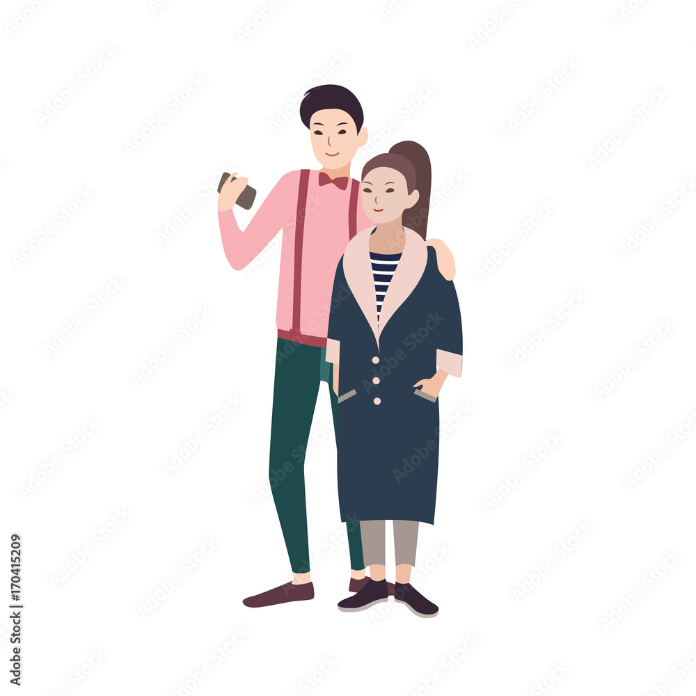 Young fashionable couple of man and woman dressed in stylish clothes embracing and making selfie on smartphone Young fashionable couple of man and woman dressed in stylish clothes embracing and making selfie on smartphone