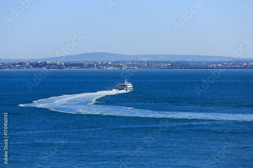 Ferry Cruising Away in Lisbon © dbvirago