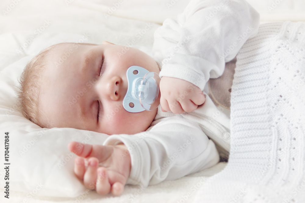 Baby sleeping covered with soft blanket Baby sleeping covered with soft blanket