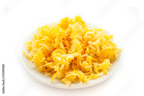 Heap of grated cheese  isolated on white background, macro image top view image.