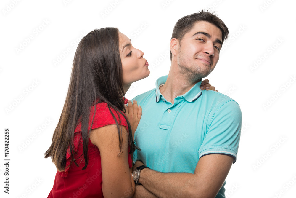 Girlfriend trying to kiss her boyfriend being playful Girlfriend trying to kiss her boyfriend being playful