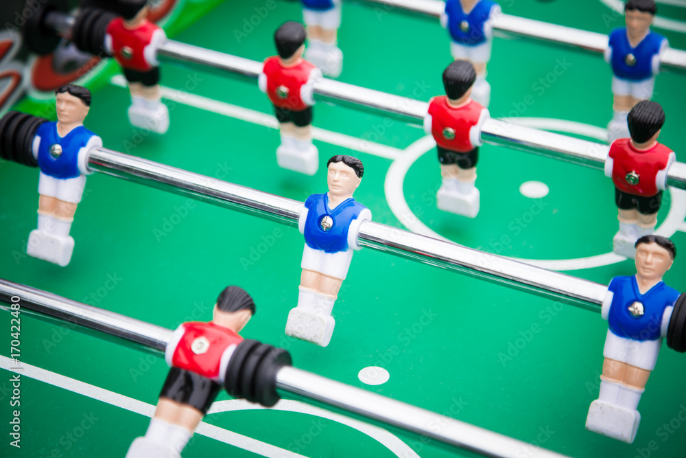 table football table football .sports teams players in red and blue uniform table football table football .sports teams players in red and blue uniform