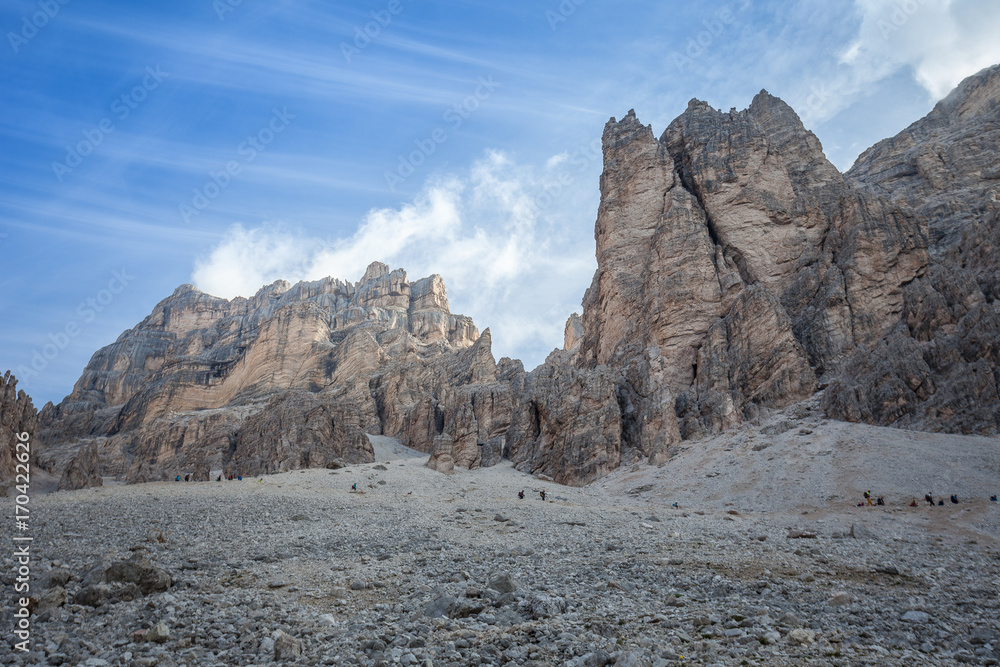 Mountaineers descend from Fontananegra pass in a wonderful rocky scenario, Cortina d'Ampezzo, Italy