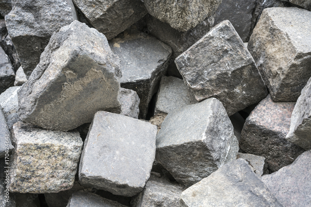 close up of a bunch of cobble stones close up of a bunch of cobble stones