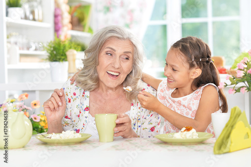 grandmother and granddaughter having breakfast