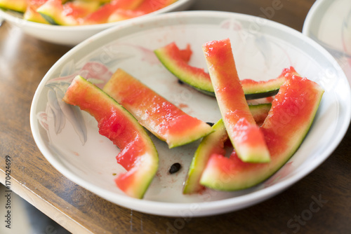after meal, peel of a watermelon on a plate