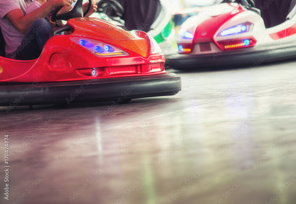 Colorful electric bumper car in autodrom in the fairground attractions at amusement park