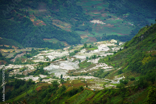 Terraced rice field in water season, the time before starting grow rice in Y Ty, Lao Cai province, Vietnam