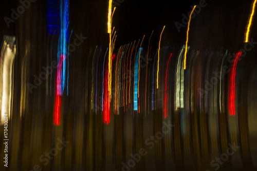 Colored lights in motion at night as abstract background