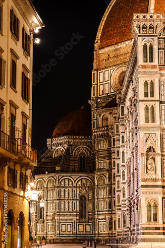 Left side of Cathedral Santa Maria of the Flowers and the Baptistery, Piazza del Duomo, Florence, Tuscany, Italy, Europe. The little dome sheltered by the famous big one in the heart of the night.