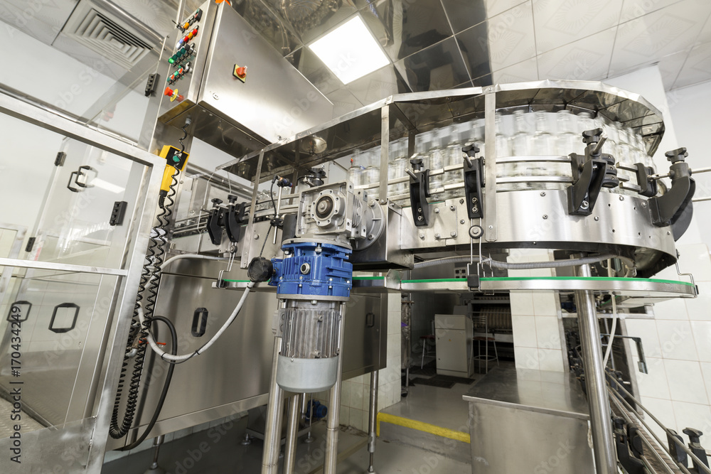 Empty glass bottles on the conveyor.