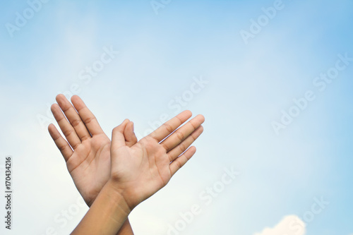 Hands shaped bird flying on sky background , concept freedom