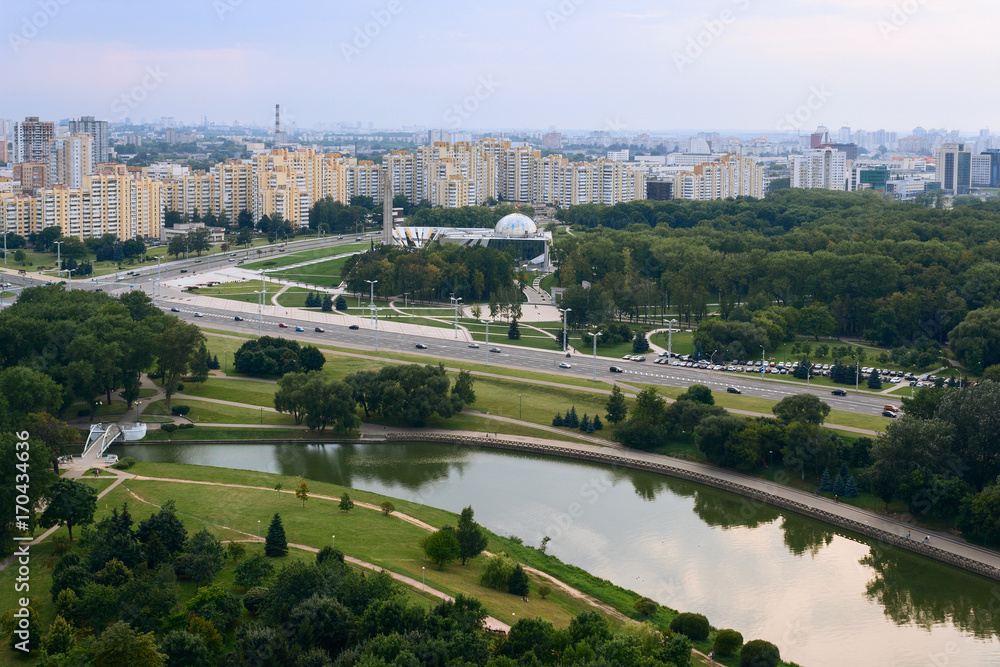 High view of Minsk cityscape, trees and buildings.