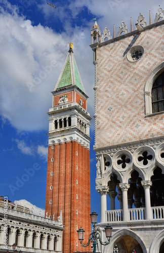 Saint Mark Bell Tower and Doge Palace with blue sky and clouds, in the center of Venice