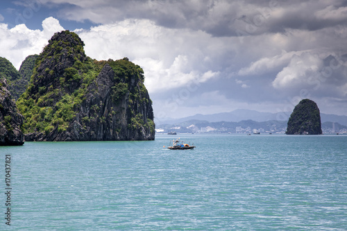 cruising among beautiful limestone rocks and secluded beaches in Ha Long bay  UNESCO world heritage site  Vietnam