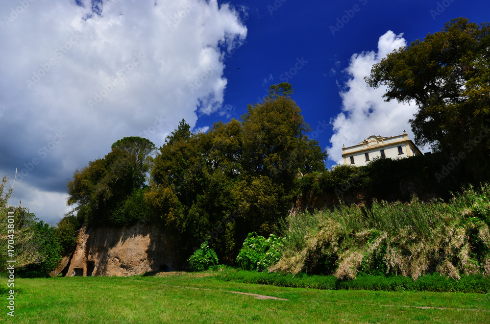 Villa Savorelli public park with ancient caves in the old town of Sutri, near Rome