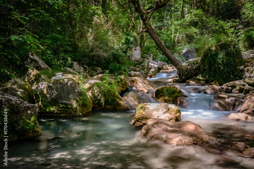 Fast-flowing mountain river in the European Alps Fast-flowing mountain river in the European Alps