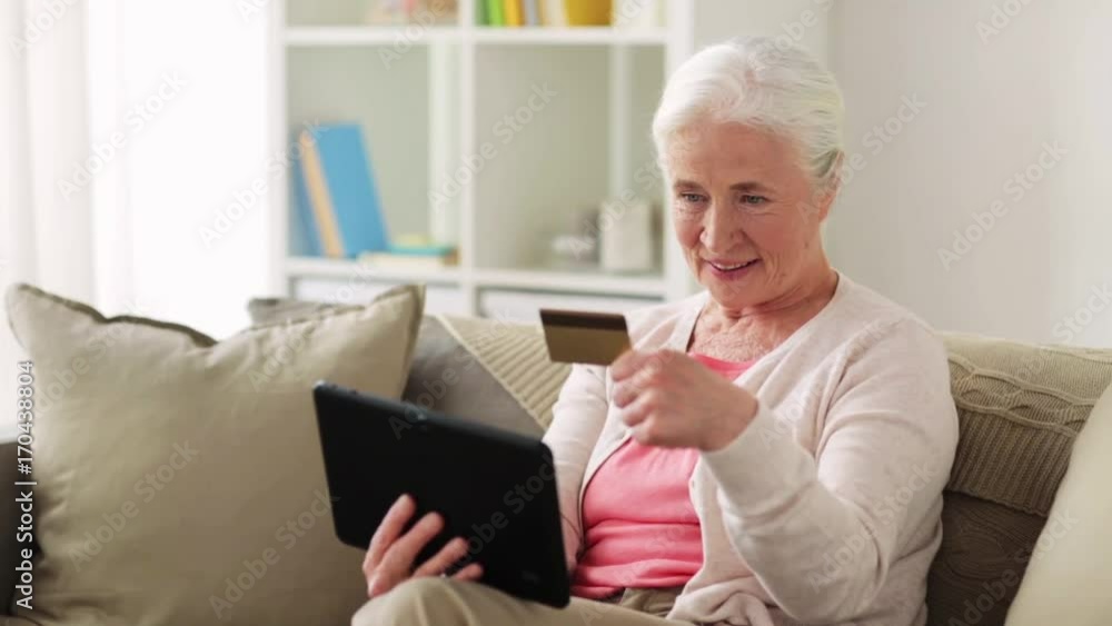 senior woman with tablet pc and credit card senior woman with tablet pc and credit card