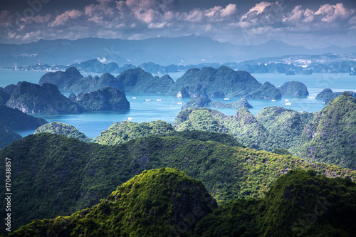 scenic view over Ha Long bay from Cat Ba island, Ha Long city in the background, UNESCO world heritage site, Vietnam