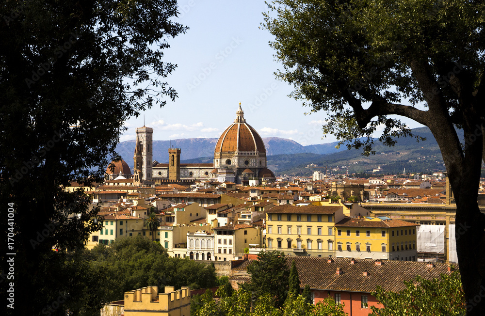 View on the Cathedral di Santa Maria del Fiore (Duomo di Firenze) between two trees, Florence, Italy