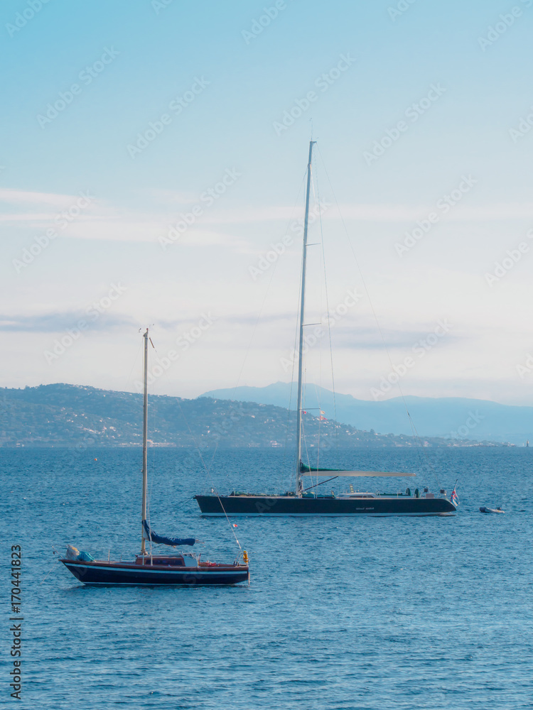 Several sailboats are anchored for the coast of Saint Tropez. Several sailboats are anchored for the coast of Saint Tropez.