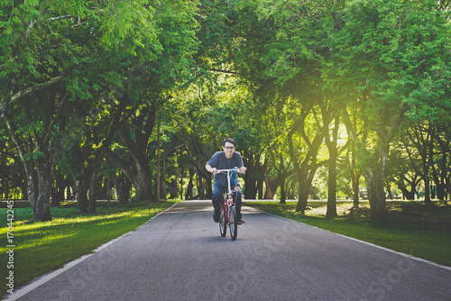 Wallpaper Mural Asian man riding bicycles in the park at morning Torontodigital.ca