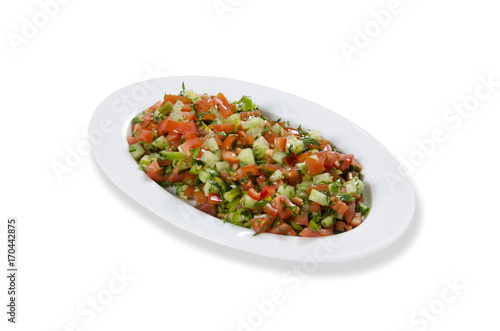 Turkish Coban salata or Shepherds salad in white bowl.
