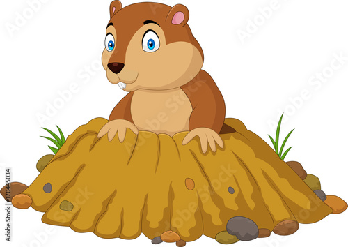 Cartoon funny groundhog standing outside its burrow
