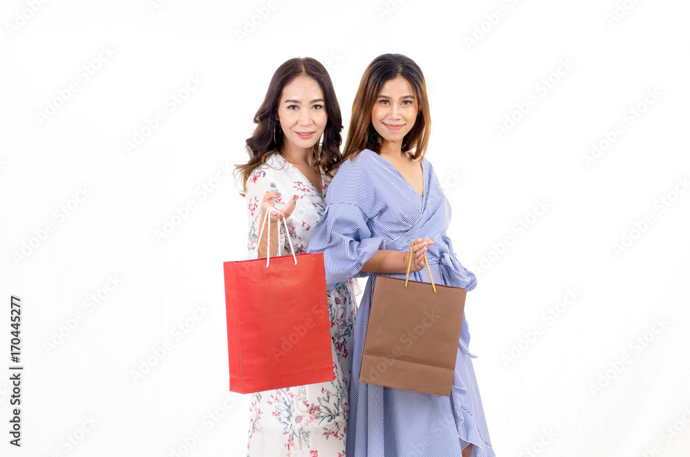 two young friends cheerful asian woman holding shopping bags isolated on white background, online shopping, payment online, sale season, lifestyle technology concept, soft focus two young friends cheerful asian woman holding shopping bags isolated on white background, online shopping, payment online, sale season, lifestyle technology concept, soft focus