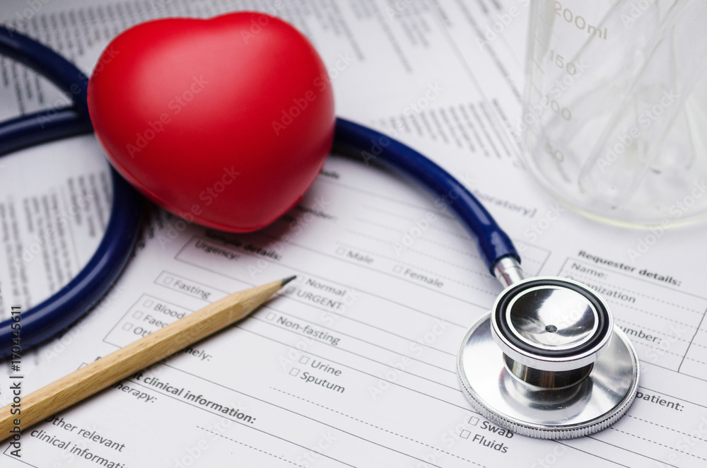 close up stethoscope, pencil, beaker, red heart and patient information form on desk, heart healthcare technology, medical diagnosis, medical report record and history patient concept, selective focus close up stethoscope, pencil, beaker, red heart and patient information form on desk, heart healthcare technology, medical diagnosis, medical report record and history patient concept, selective focus