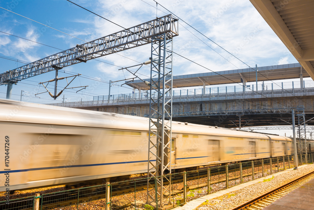 Modern high speed train at the railway station with motion blur effect Modern high speed train at the railway station with motion blur effect
