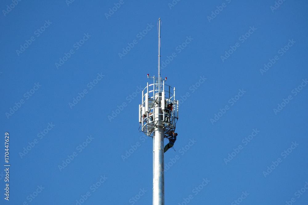 workers on a telecommunication tower workers on a telecommunication tower