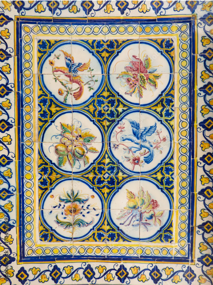 Beautiful and colorful Portuguese tiles (azulejos) with drawings of birds and plants inside Mercado da Ribeira (Lisbon, Portugal)