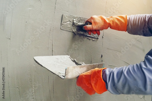 Print op canvas Hand image worker Concrete plaster