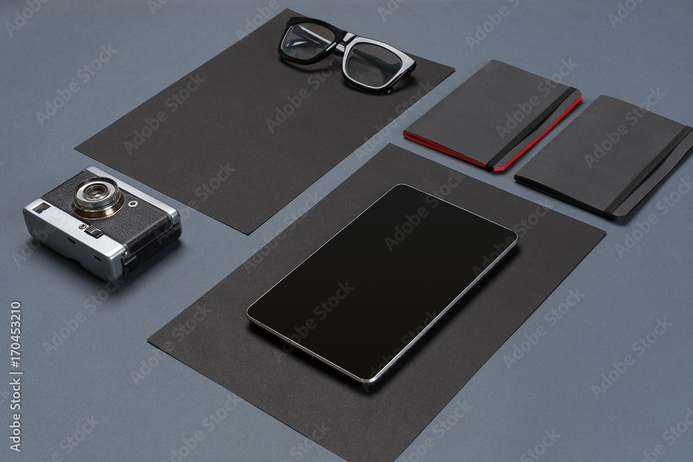Modern mock up flat lay of notebook and stationery on gray background. Modern mock up flat lay of notebook and stationery on gray background.