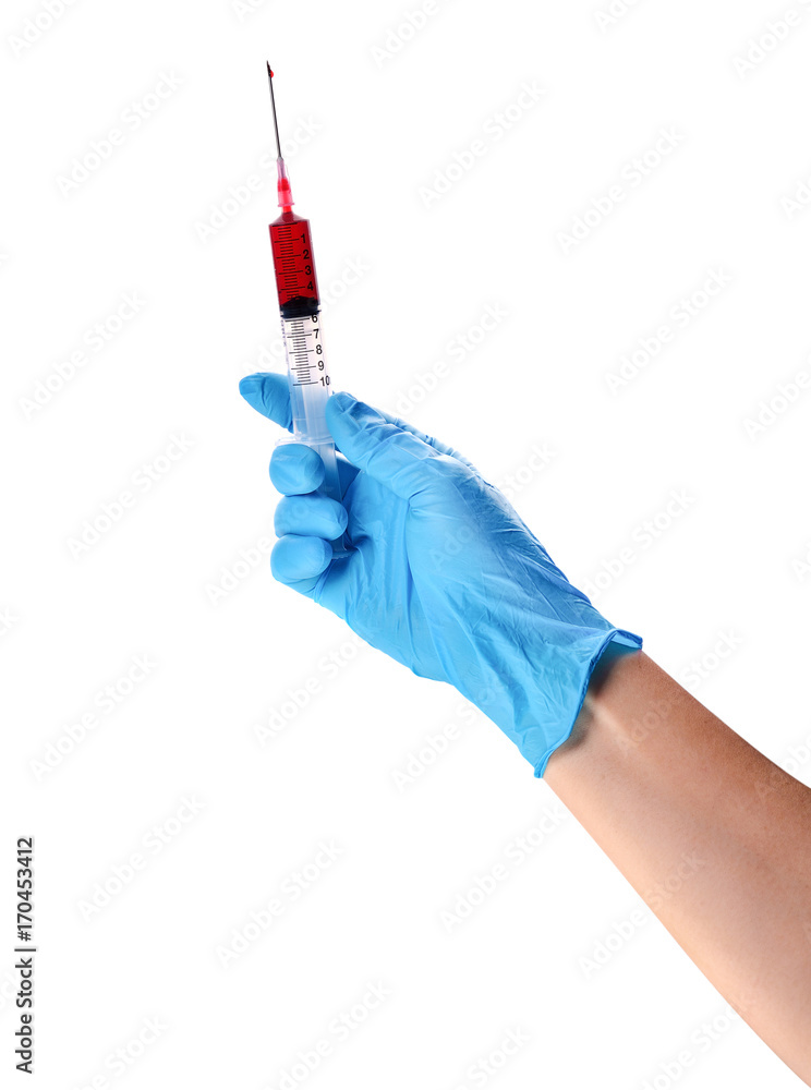 Hand in a blue glove holding syringe isolated on white