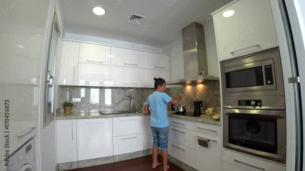 Hungry child in the kitchen Hungry child in the kitchen