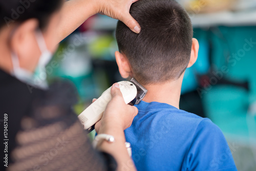 Little boy haircut in the barber