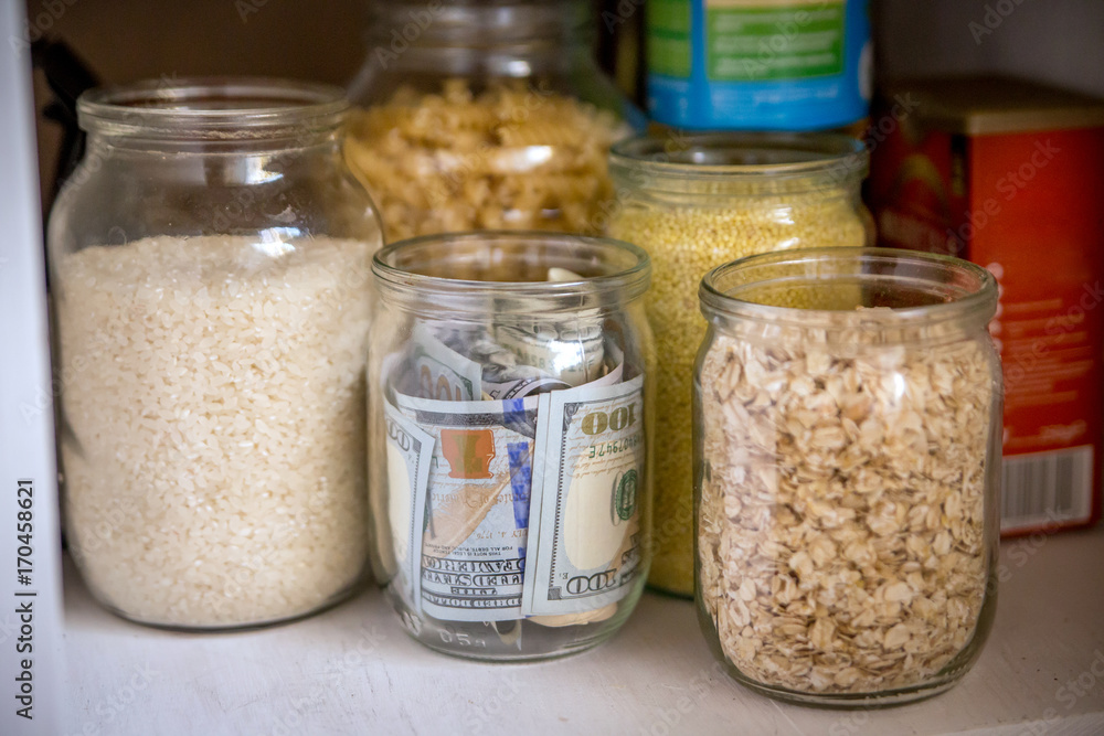 Hidden glass jars with dollars between another jars Hidden glass jars with dollars between another jars